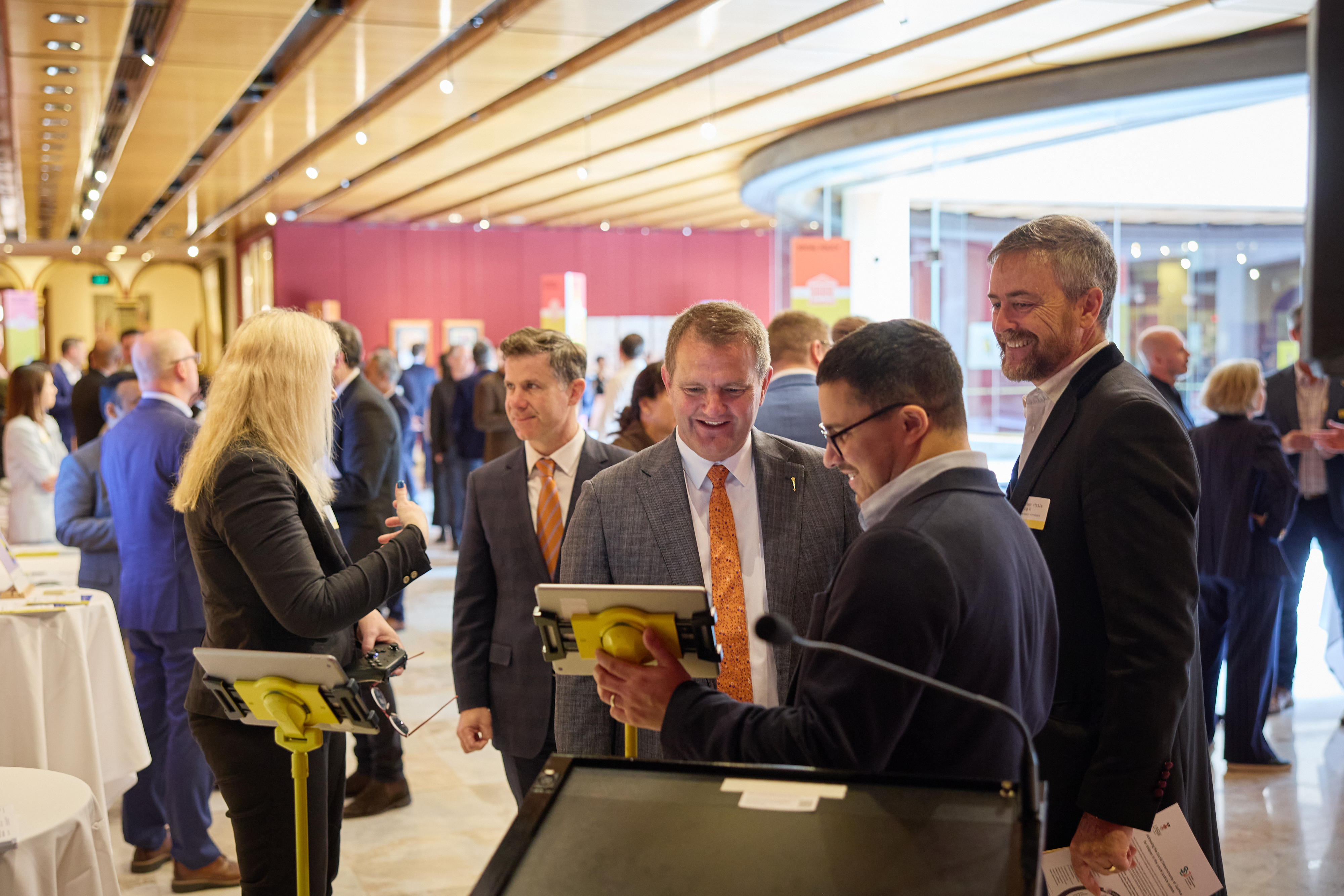 Dr James Dunn engaging with attendees at the NSW Parliament showcase